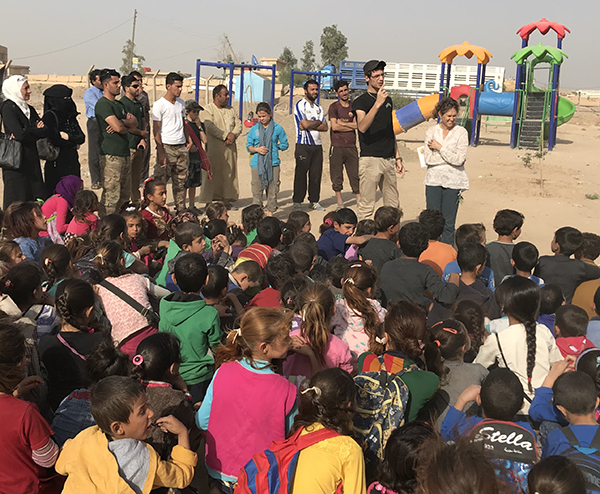 Baran translating during a Good Life Club program in Syria.