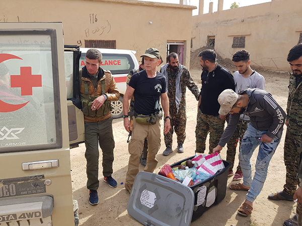 Delivering medicine to the casualty collection point at the Hajin front.