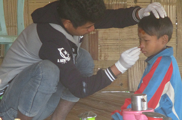 The Pa-Oh Ranger team providing medical support to villagers.