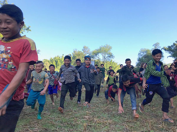 The start of the Tha Da Der Run for Relief - taking off across wet rice paddies.