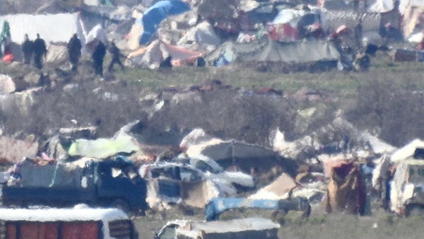 Armed ISIS fighters in the camp amongst the families.