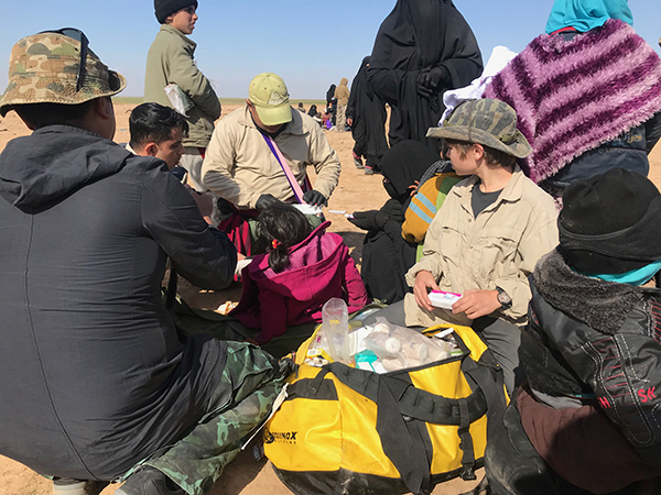 Eliya and Jason, two FBR medics, treat the sick and wounded.