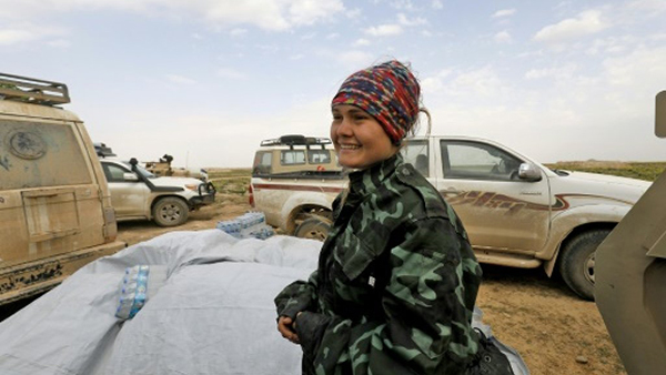 From the article: Sahale Eubank, a volunteer with the Free Burma Rangers (FBR), is pictured at a plateau overlooking the embattled Baghouz area in the eastern Syrian province of Deir Ezzor AFP