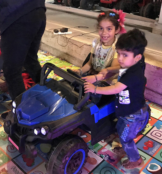 Suriya and her brother learn to drive.