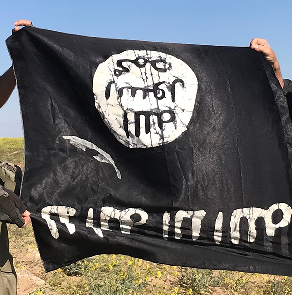 An upside down, captured ISIS flag.