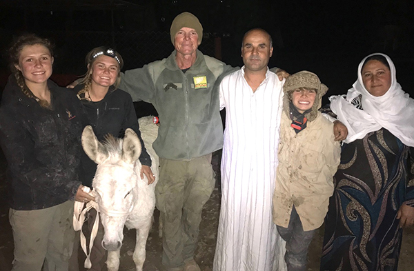 Snowflake, the orphaned donkey, with Sahale, Dave, Peter, and a new family.