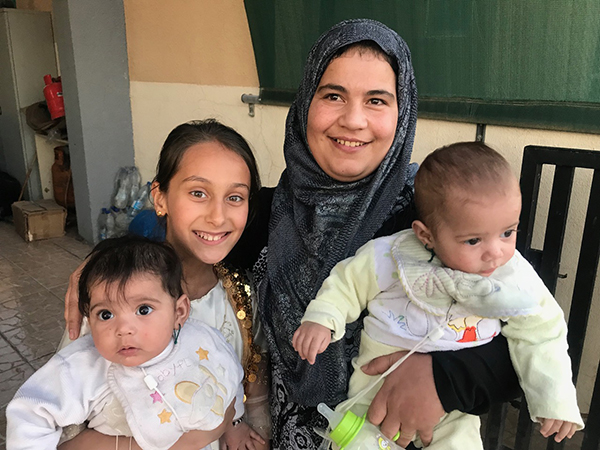 Eman with her twins she had one year after she was rescued and Mohammed's daughter.