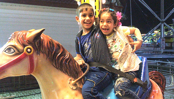 Riding together on the merry-go-round.