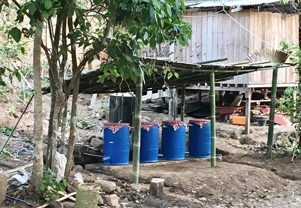 Using a four-barrel cleaning process, the biochar water filter system now provides clean water at JSMK.