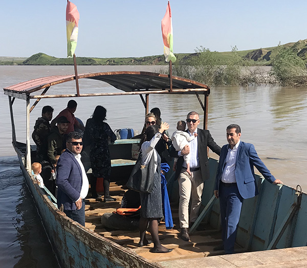 The seven Swedish children crossing the Tigris River from Syria to Kurdistan on their way home.