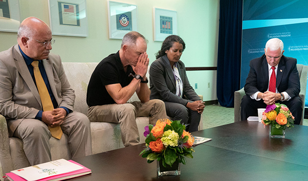 Praying with Vice President Pence.