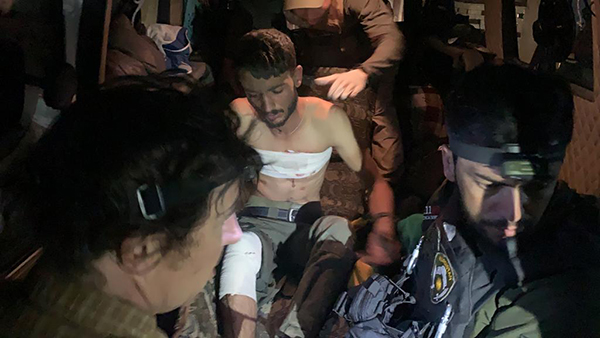Our team treating a wounded Kurd near Tel Tamir on Oct. 30.