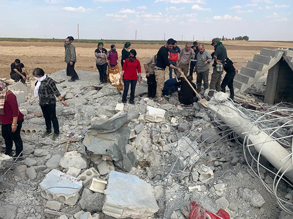 Digging out bodies from an Oct. 15 Turkish airstrike in Musherfa, south of Seri Kani