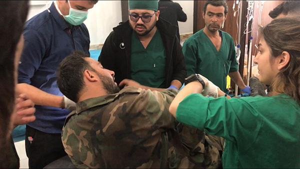 Staff at Tel Tamir Hospital treating wounded Syrian Army soldiers who were hit by Turkish/FSA mortars on Nov. 9.