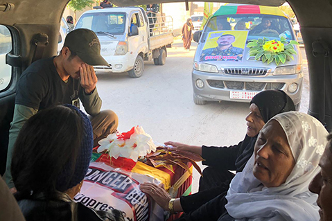 Joseph, crying over the loss of Zau, and the Kurdish women as they sang over Zau's coffin.