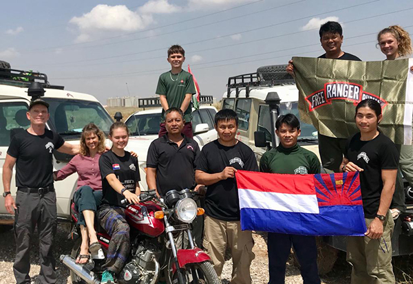 Zau Seng, in the top right corner, with the Eubank family and Karen rangers during a Middle East mission. Eh Paw is in the front row, second from right.