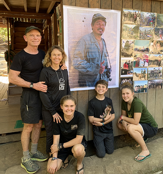 The Eubank family at the new Zau Seng memorial wall at their TUW Camp home