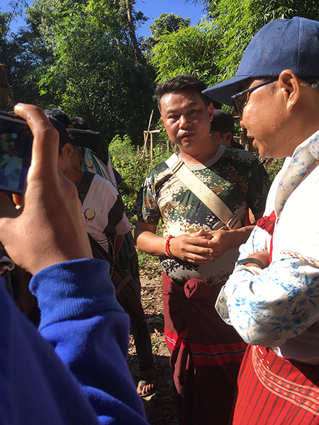 Burma Army Lt. Col. Htin Lin Aung listening to villagers at the Nov. 18 protests.