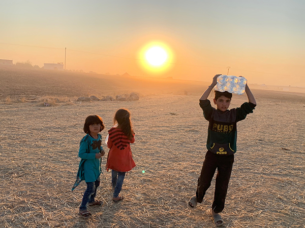 Giving water to families in the desert.