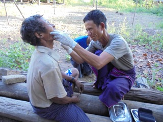 A Ranger provide dental care during the mission