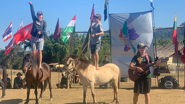 Suu, Peter, and Sahale singing "Rangers Lead the Way"