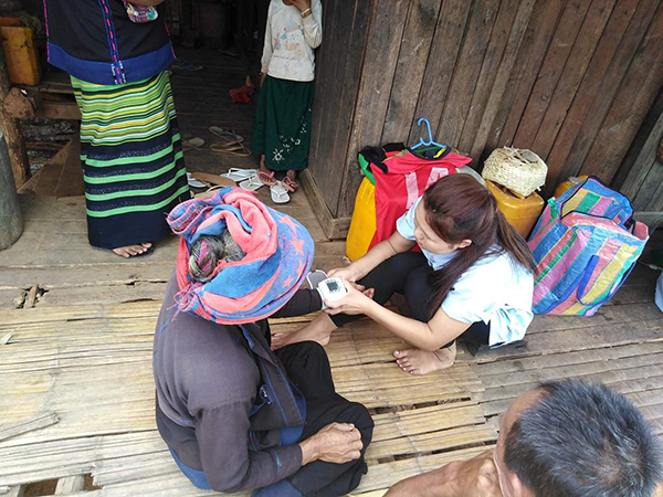Providing medical care to a local villager
