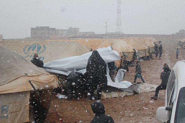 Families from Idlib in the Manbij camp as it snows today, 8 Feb. 2020.