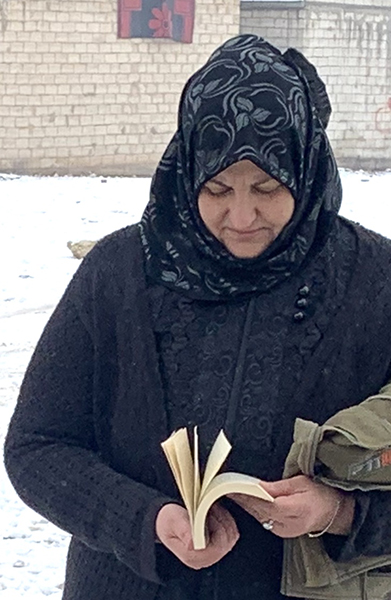 Idlib woman with Bible 