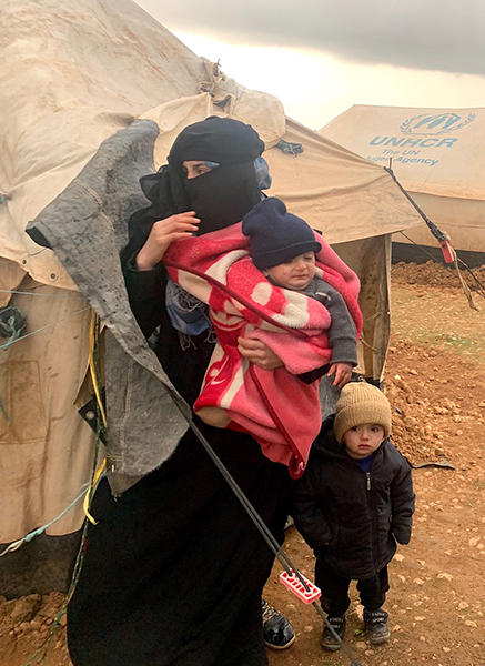 A mother and her children face the storm.