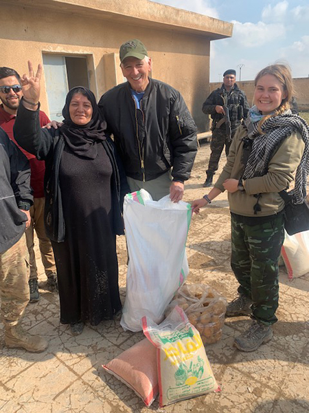 Helping give food to displaced people near Tel Tamir