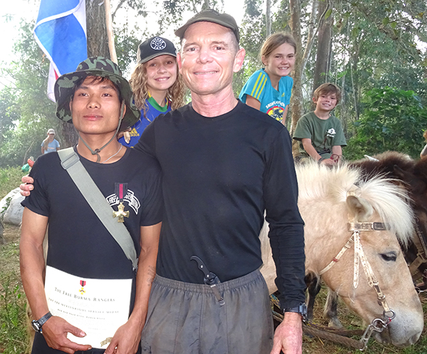 Saw Maung La Htoo receives Meritorious Service Medal with the Eubank family in Karen State, 2014.