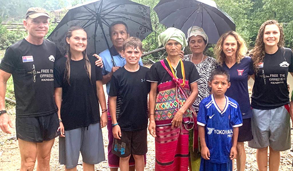 With widow Naw Yu Mer (center) whose husband was killed here near Saw Mu Plaw by the Burma army 