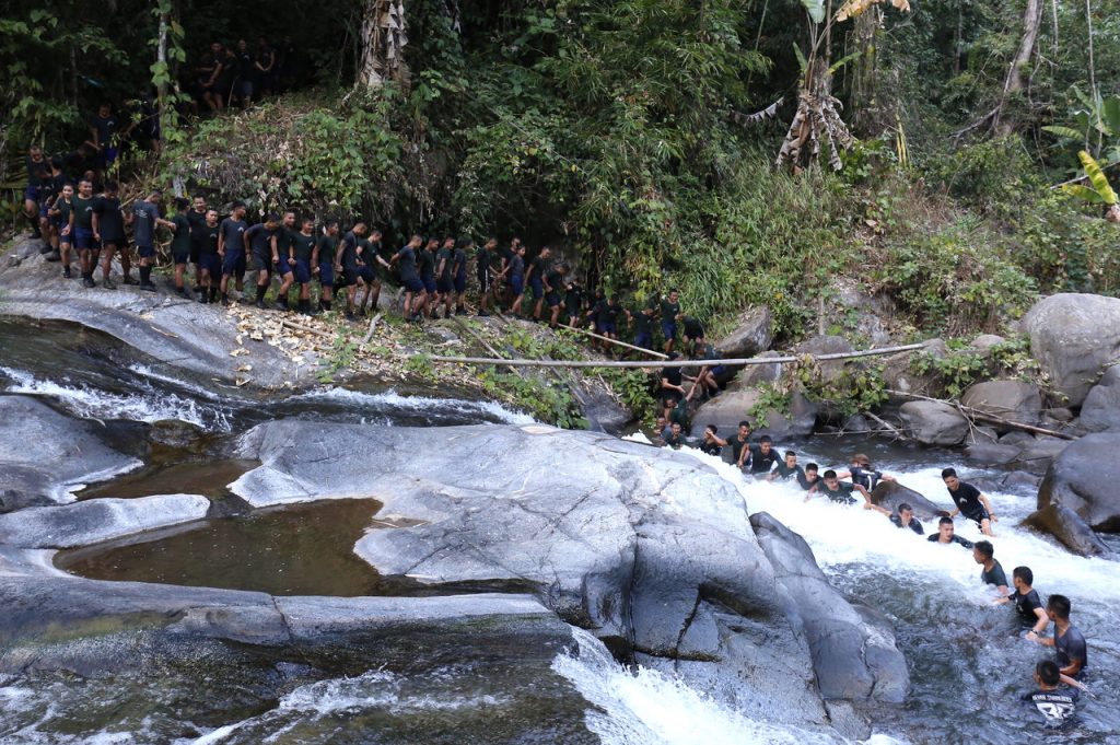 Helping each other across a river