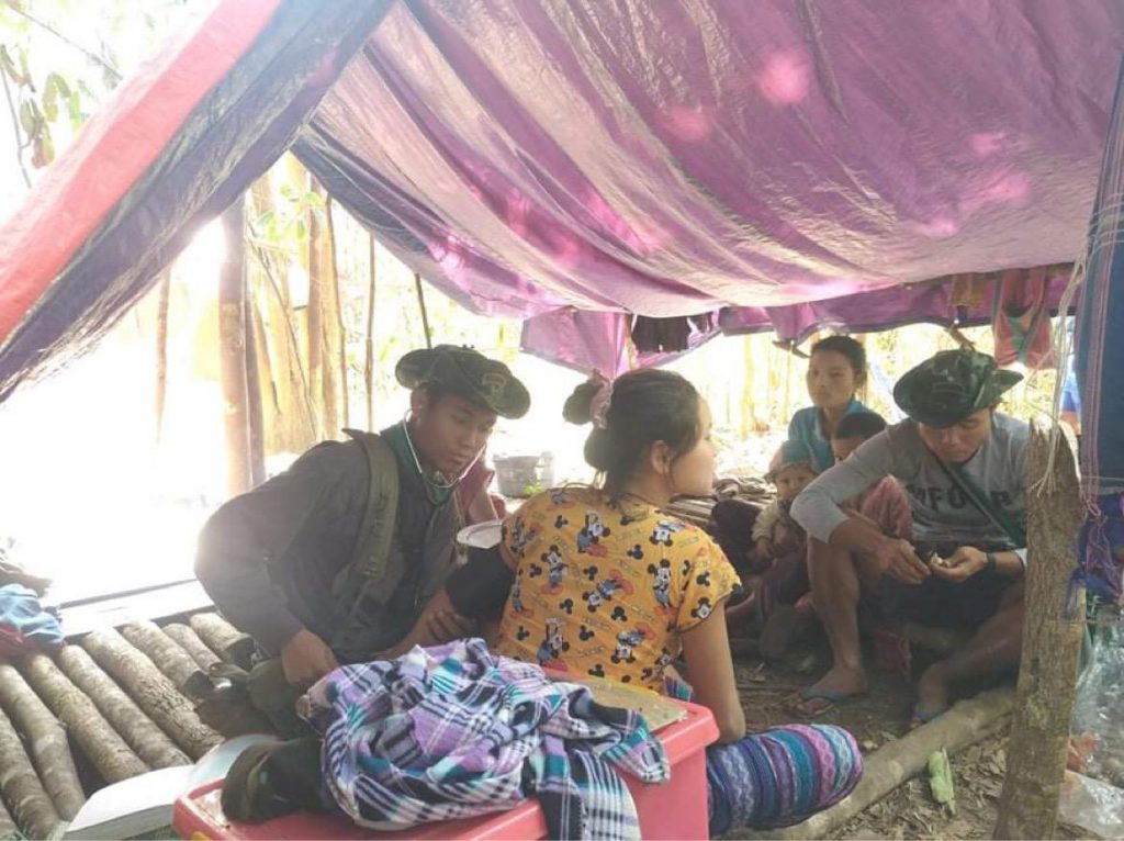 Rangers provide medical care for villagers hiding in the jungle