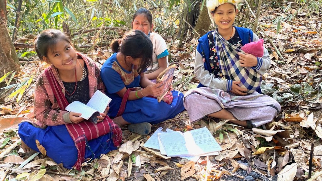 24-year-old teacher with new-born baby and her students