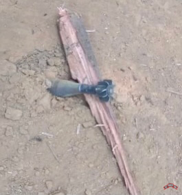 Unexploded mortar in village, Luthaw Township