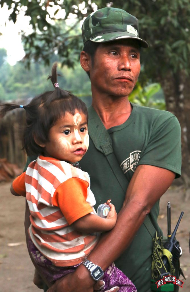 brilliant eyes Karen soldier with child